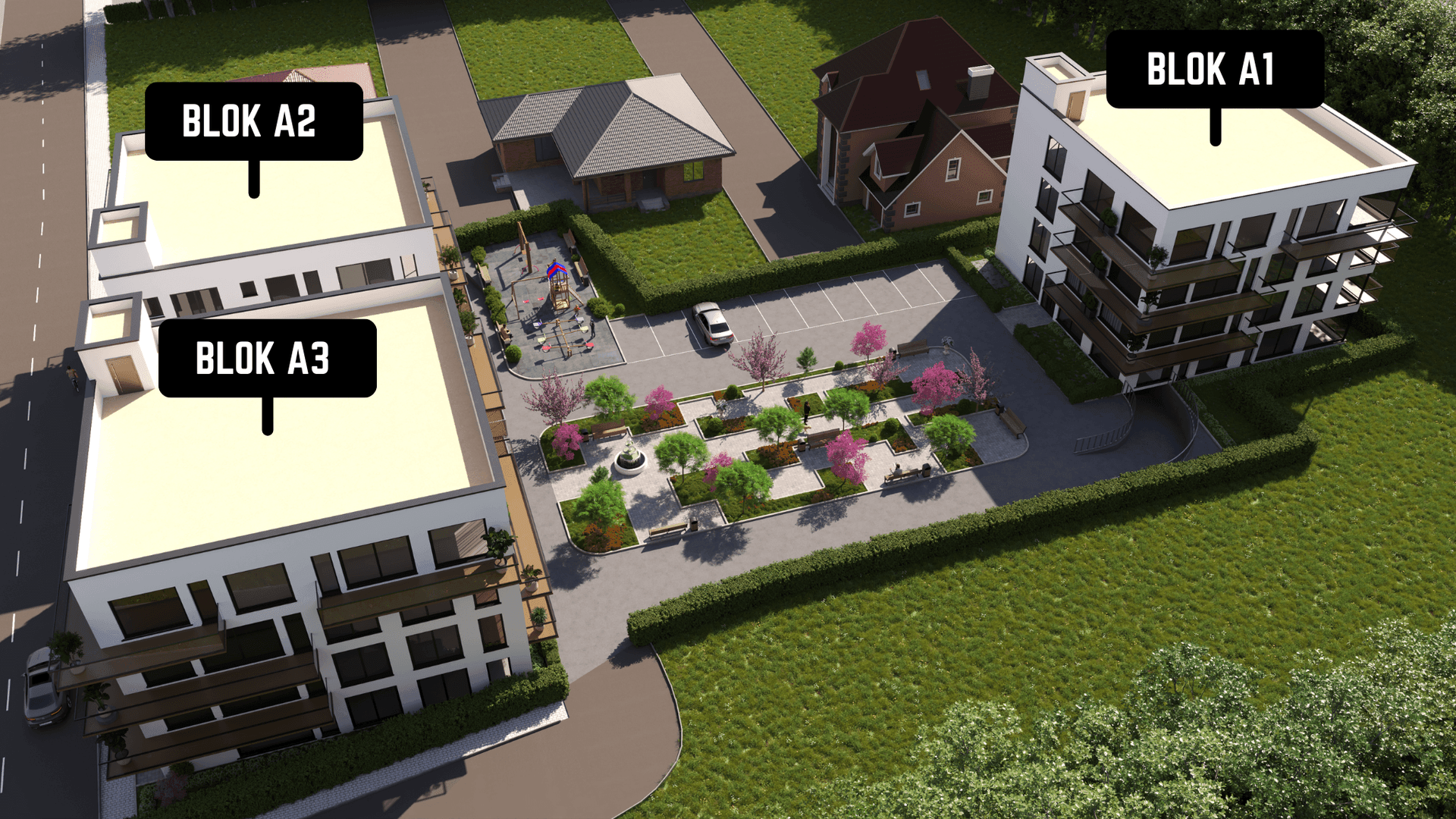 aerial picture of 3 new buildings with parking and park in front